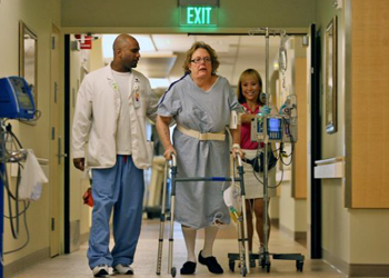 Physical therapists guide Jane Glenn Haas, center logo