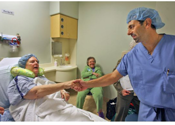 Dr. Robert Gorab, right, greets Jane Glenn logo