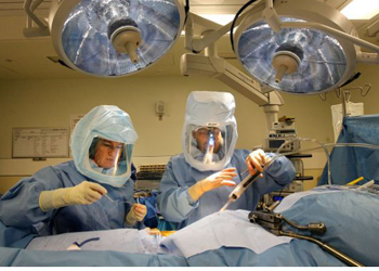 Jane Glenn Haas is removed from the Hana table after surgery logo