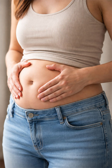 Specialist assessment of a patient experiencing abdominal bloating and distension in Dubai.