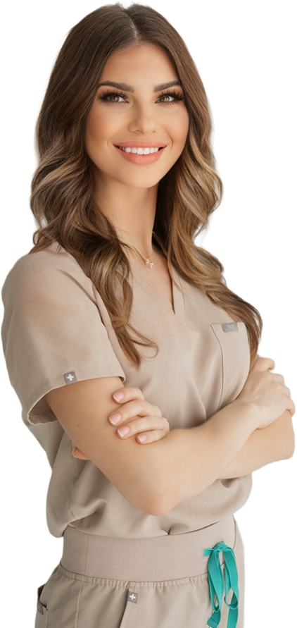 Yana, founder of Skin Rituals Miami, stands confidently in scrubs with arms crossed.