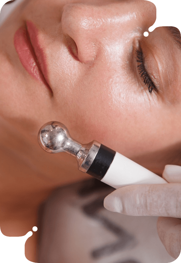 A woman receiving an Eyes & Lips MesoTherapy facial treatment.
