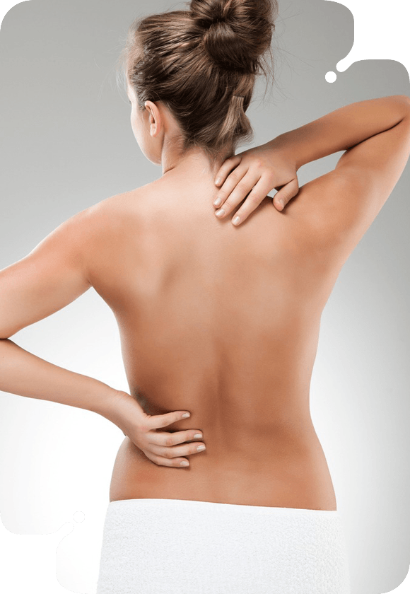 A woman illustrating the Purifying Back Treatment for back pain.